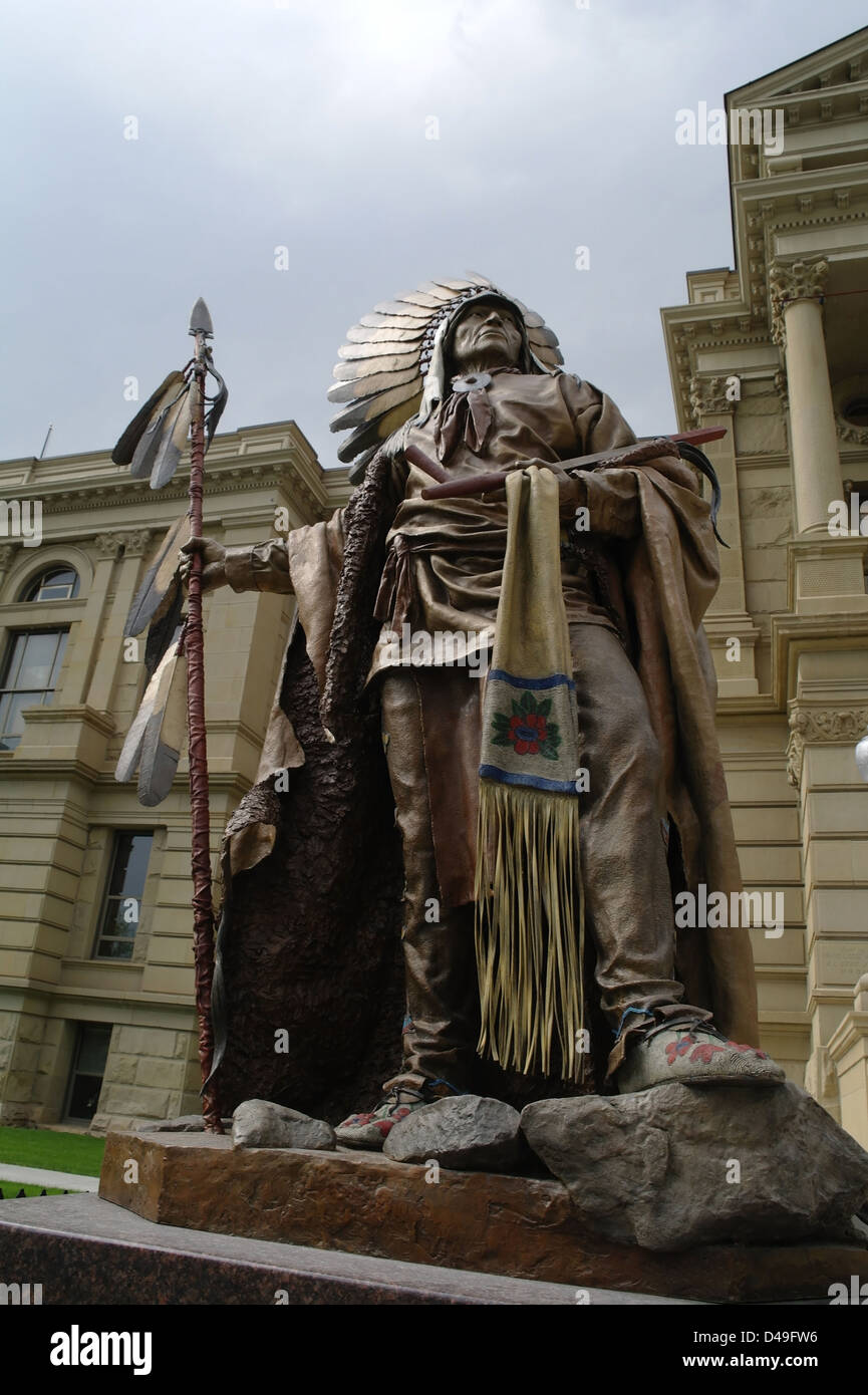 Grey sky portrait view bronze statue Chief Washakie standing plinth