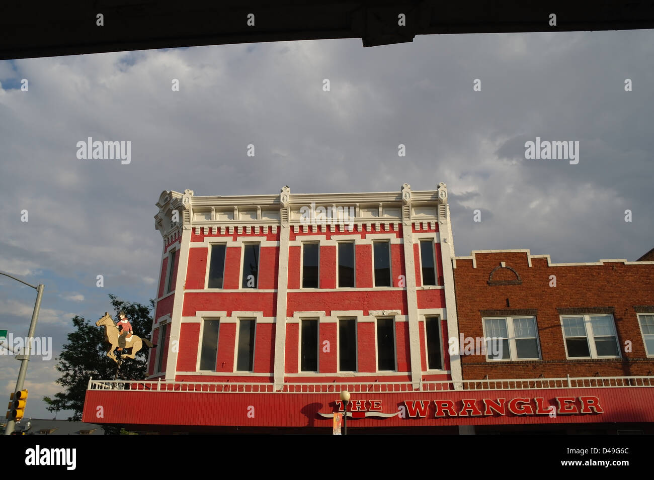 Grey sky evening view red paint Wrangler ranchwear cowboy clothes shop