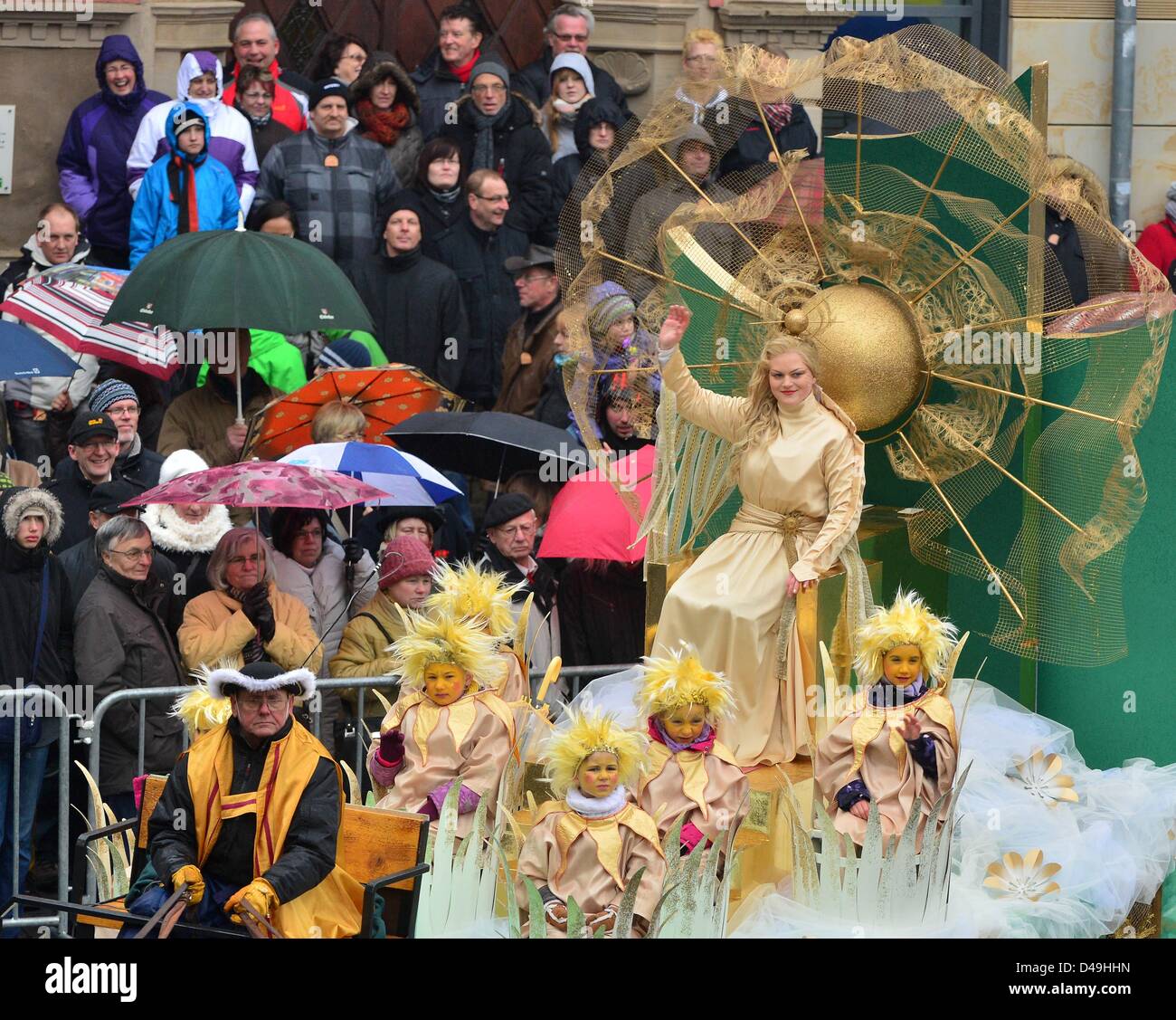 People view a parade of floats at the traditional spring festival