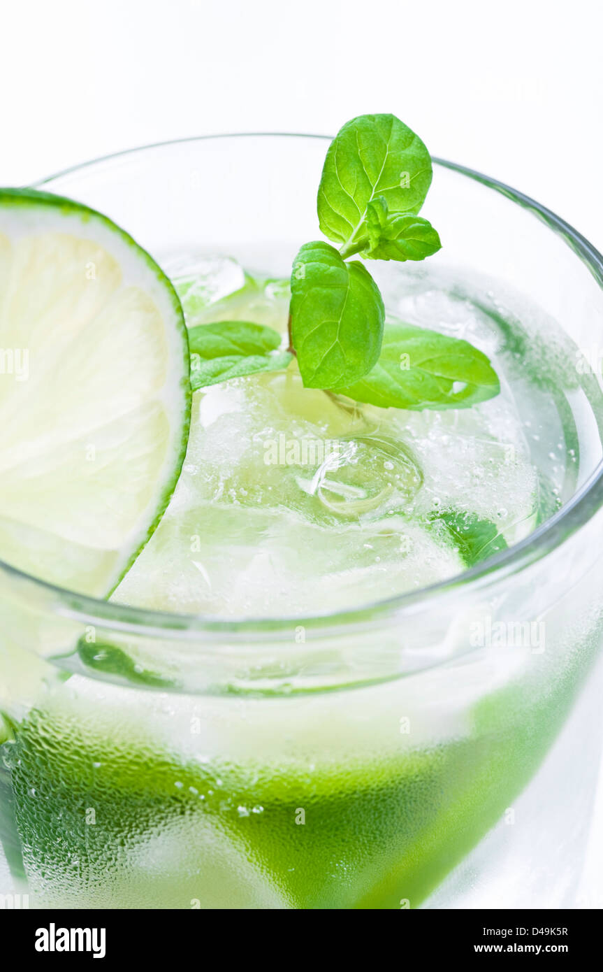 Glass of mojito drink with ice, fresh mint and lime Stock Photo