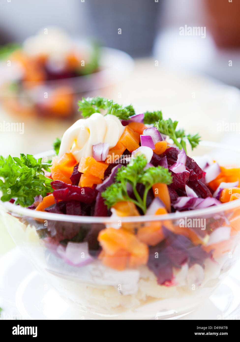 Appetizing salad in a transparent salad bowl, food closeup Stock Photo