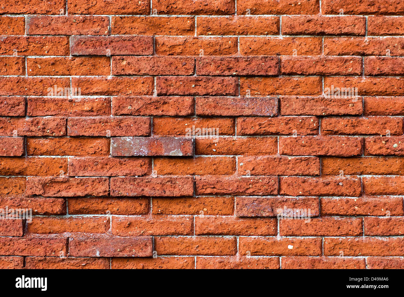 Uneven Brick Wall Stock Photo