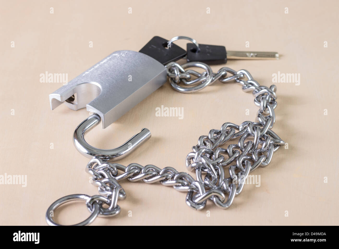 Chain with open padlock,on wooden table Stock Photo