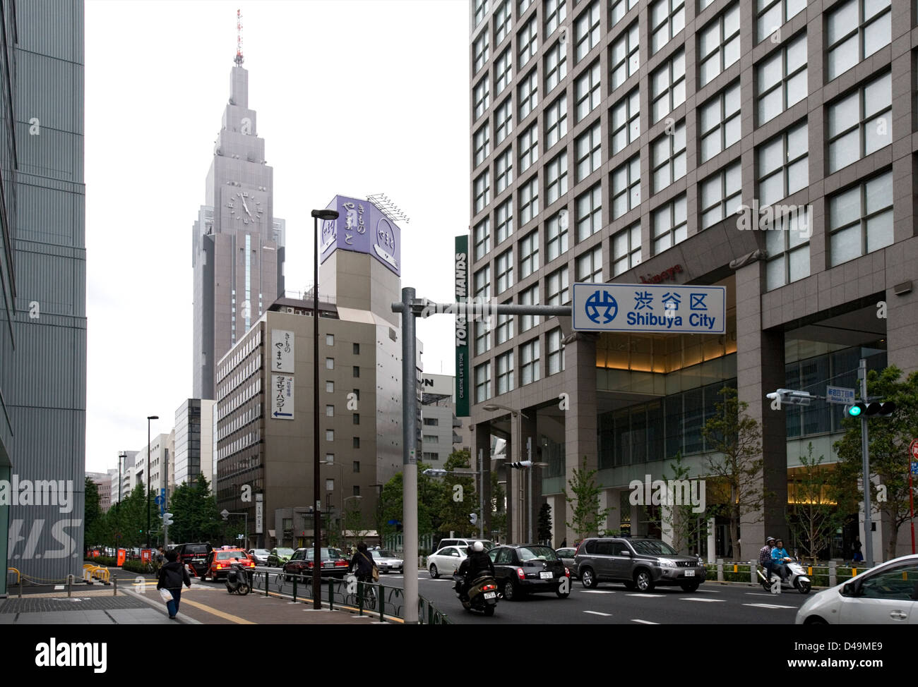 Street scene in Shibuya, Tokyo with the NTT Docomo building and the Tokyu Hands department store. Stock Photo