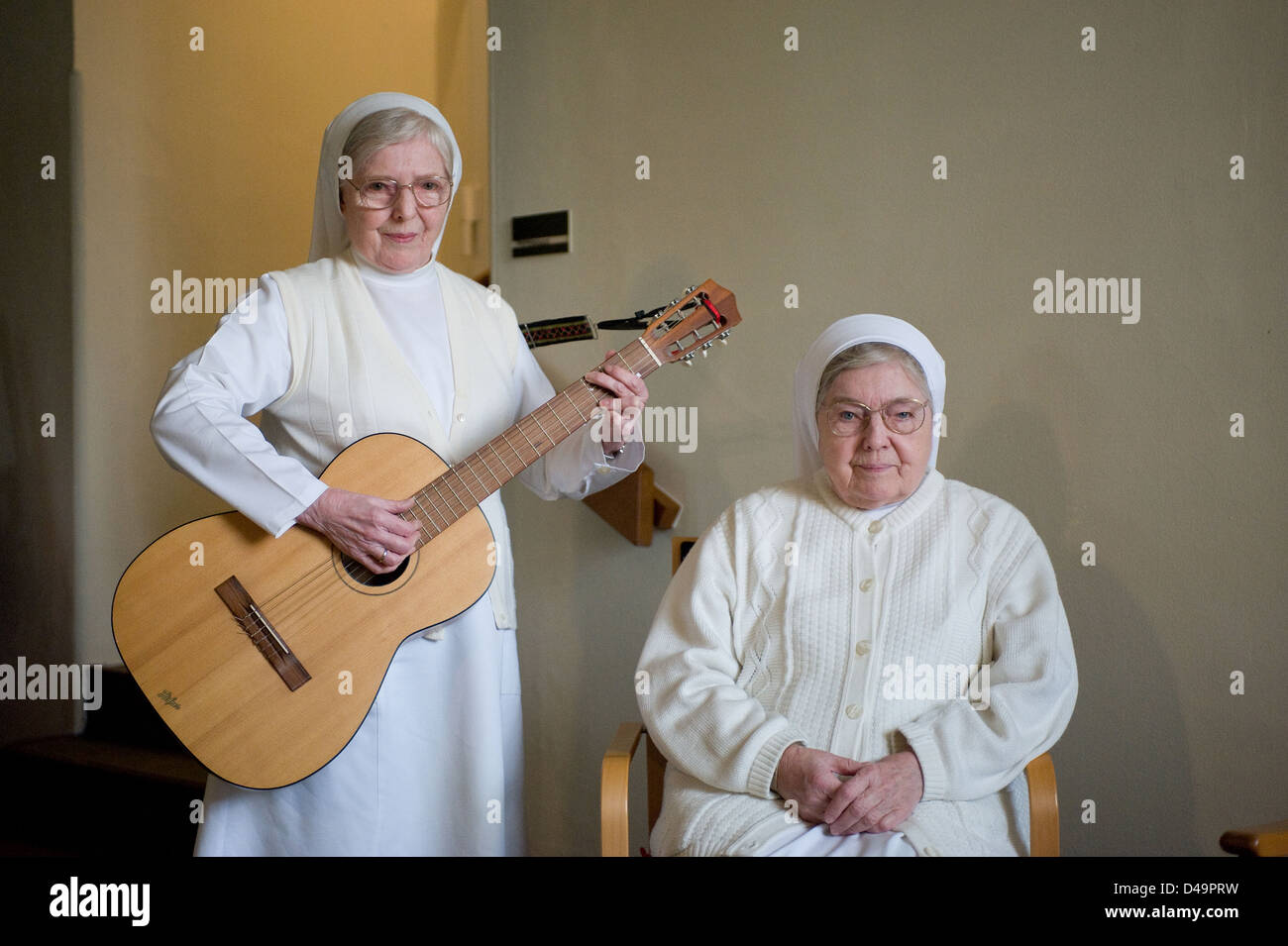 Heitersheim, Germany, a sister plays guitar Stock Photo