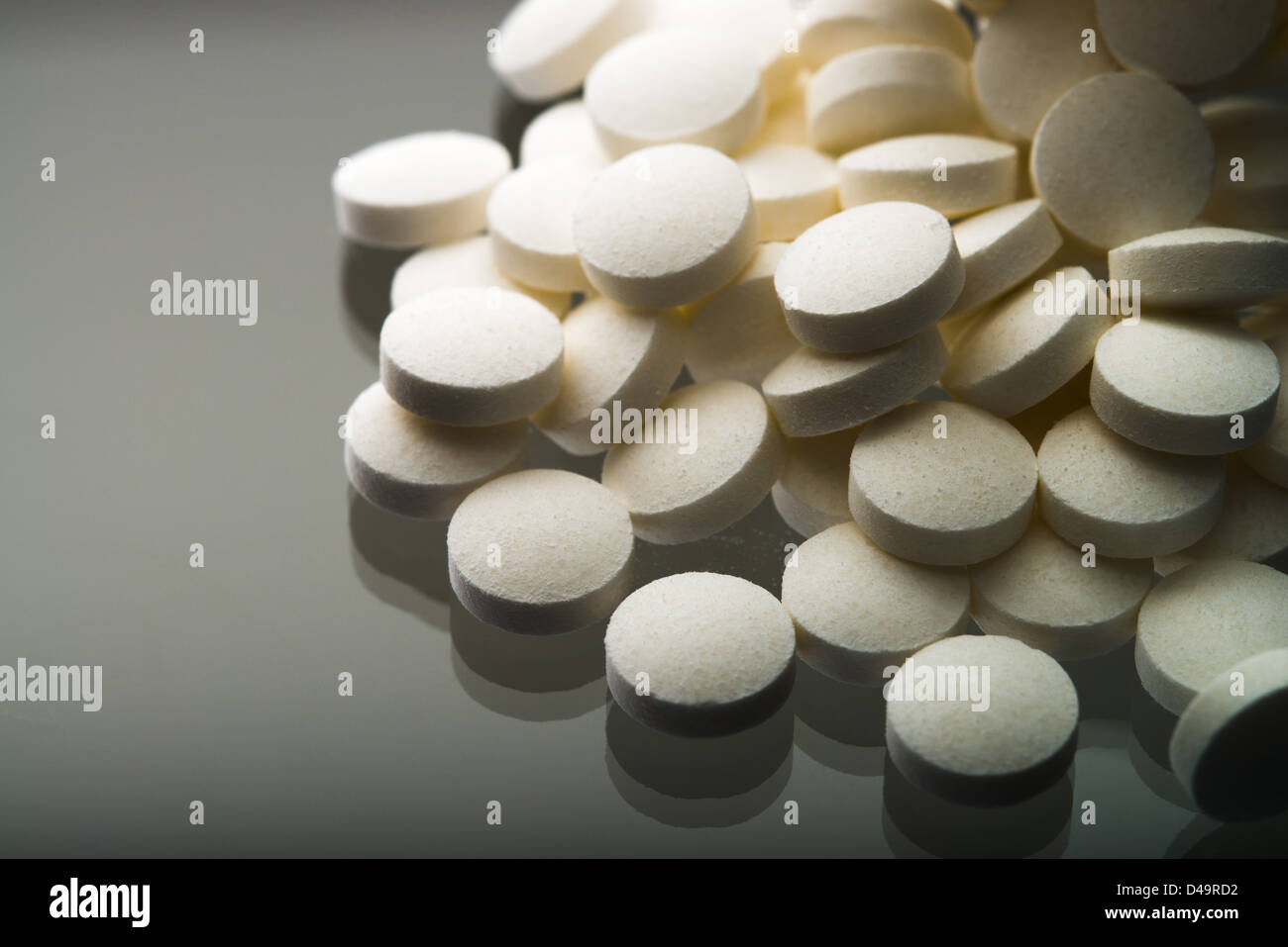 Aspirin tablets falling out of a jar Stock Photo Alamy