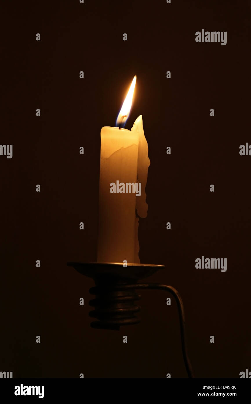 Burning candle with dripping wax hires stock photography and images