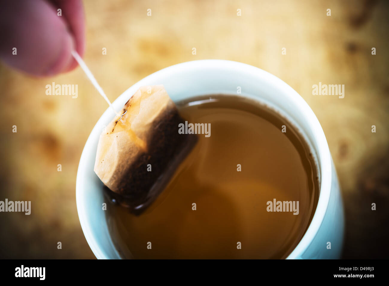 Making a cup of tea, using a teabag on a string Stock Photo Alamy