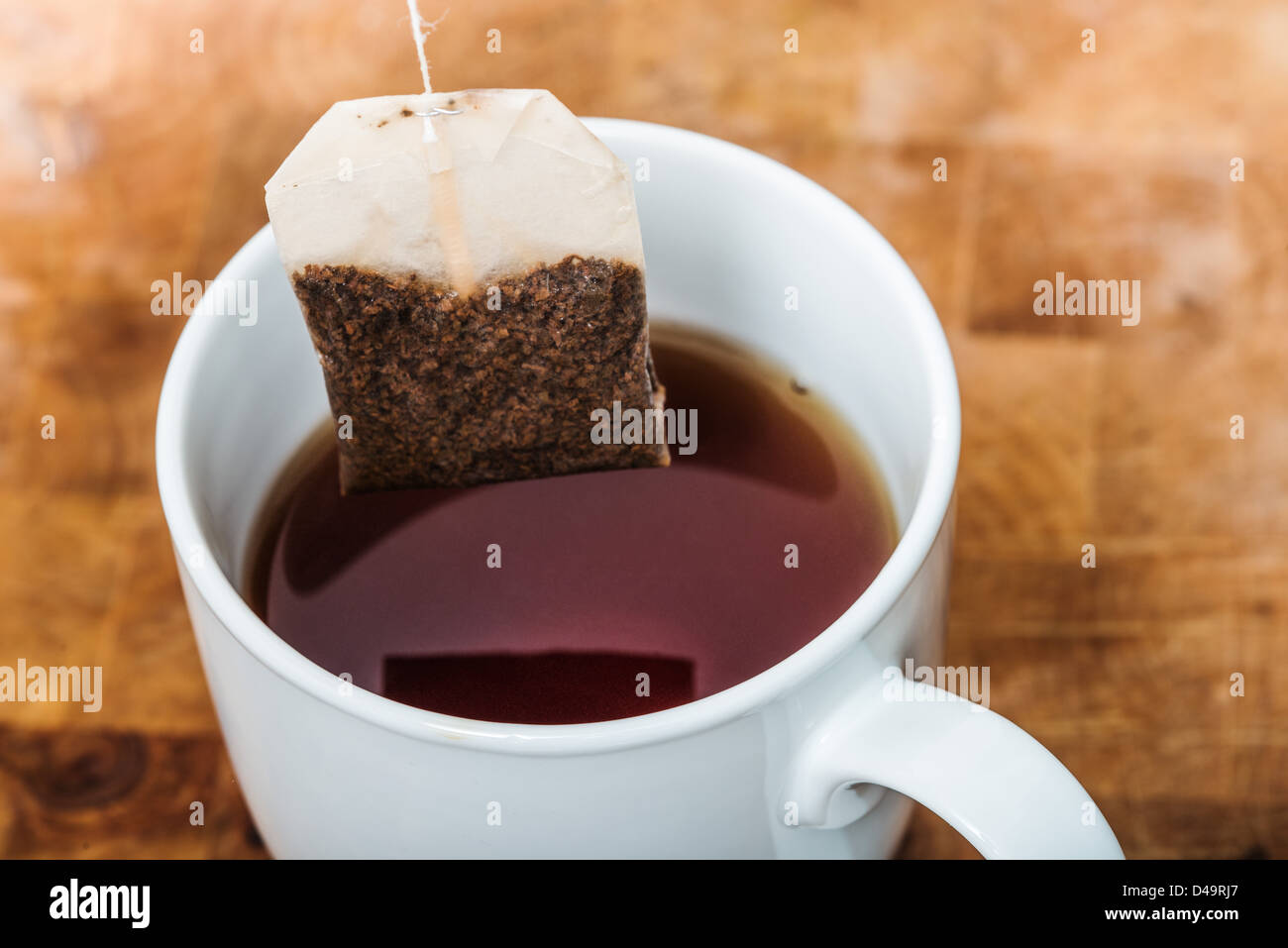Making a cup of tea, using a teabag on a string Stock Photo Alamy