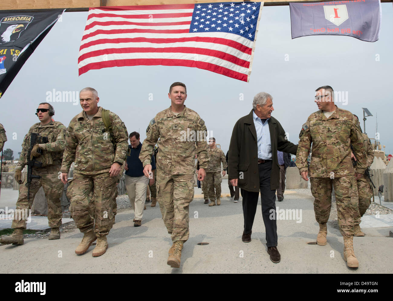 US Secretary of Defense Chuck Hagel walks with Lieutenant General James Terry, Commander ISAF Joint Command, Colonel Joseph McGee, and  Command Sergeant Major Thomas Eppler March 9, 2013 in Jalalabad, Afghanistan. Hagel is in Afghanistan on his first trip as the Secretary of Defense and will meet with US troops, NATO and Afghan leaders. Stock Photo
