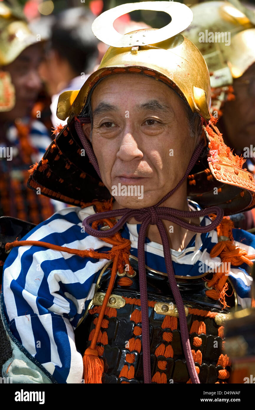 Weekend samurai warrior dressed in armor with helmet partakes in annual spring Shunki Reitaisai Grand Festival parade in Nikko Stock Photo