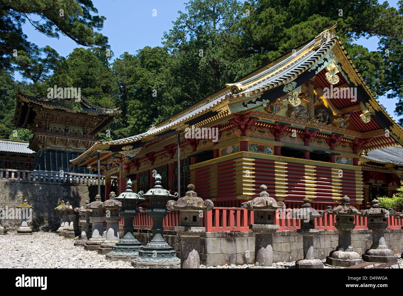 Ornate gold decorated sacred buildings surrounded by stone lanterns at Toshogu Jinja Shrine in Nikko, Tochigi, Japan. Stock Photo