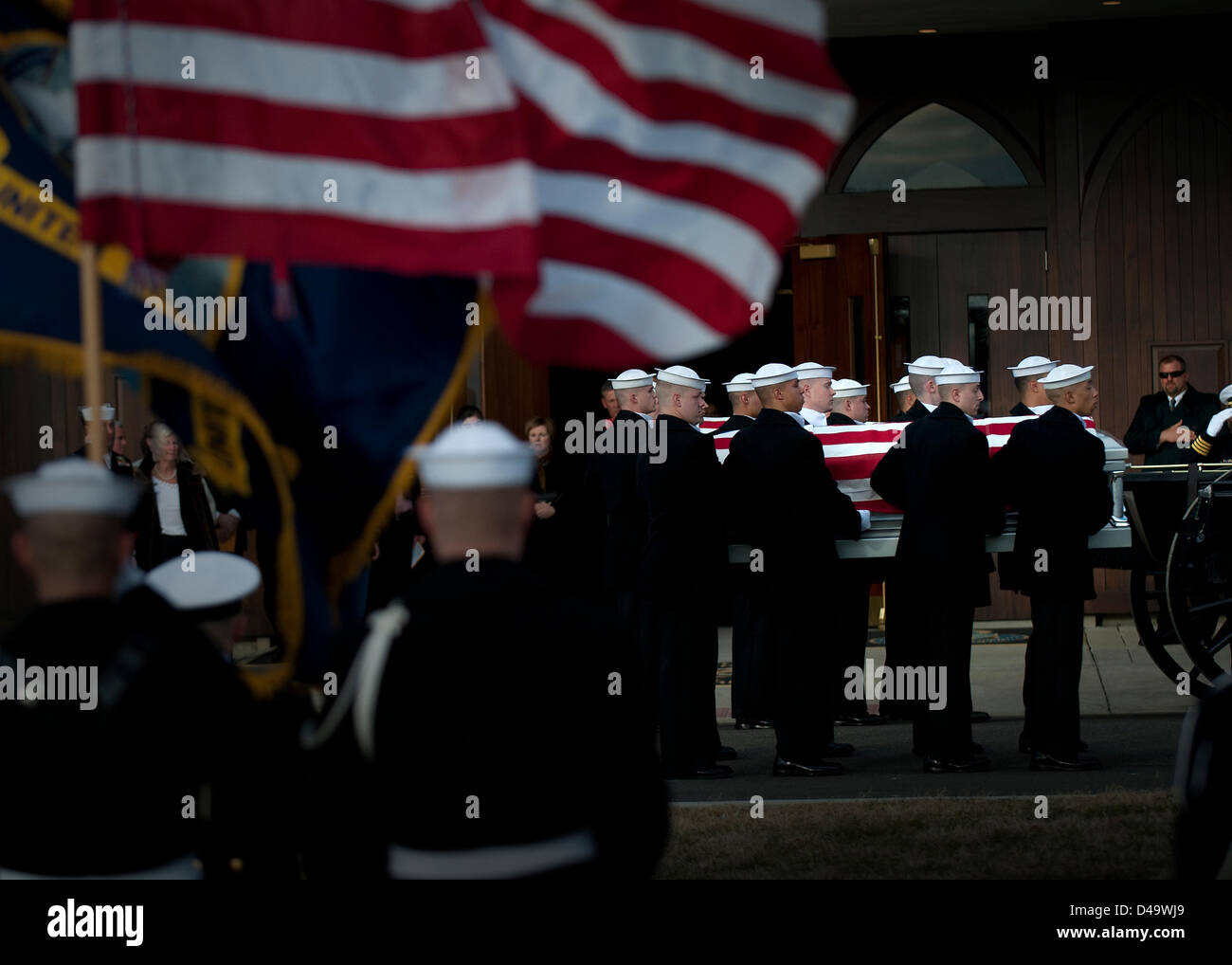 Members of the US Navy Ceremonial Guard escort the caskets during the funeral with full military honors for two Sailors recovered from the ironclad USS Monitor at Arlington National Cemetery  March 8, 2013 in Arlington, VA. The Monitor sank off Cape Hatteras, NC during the Civil War in 1862. Stock Photo