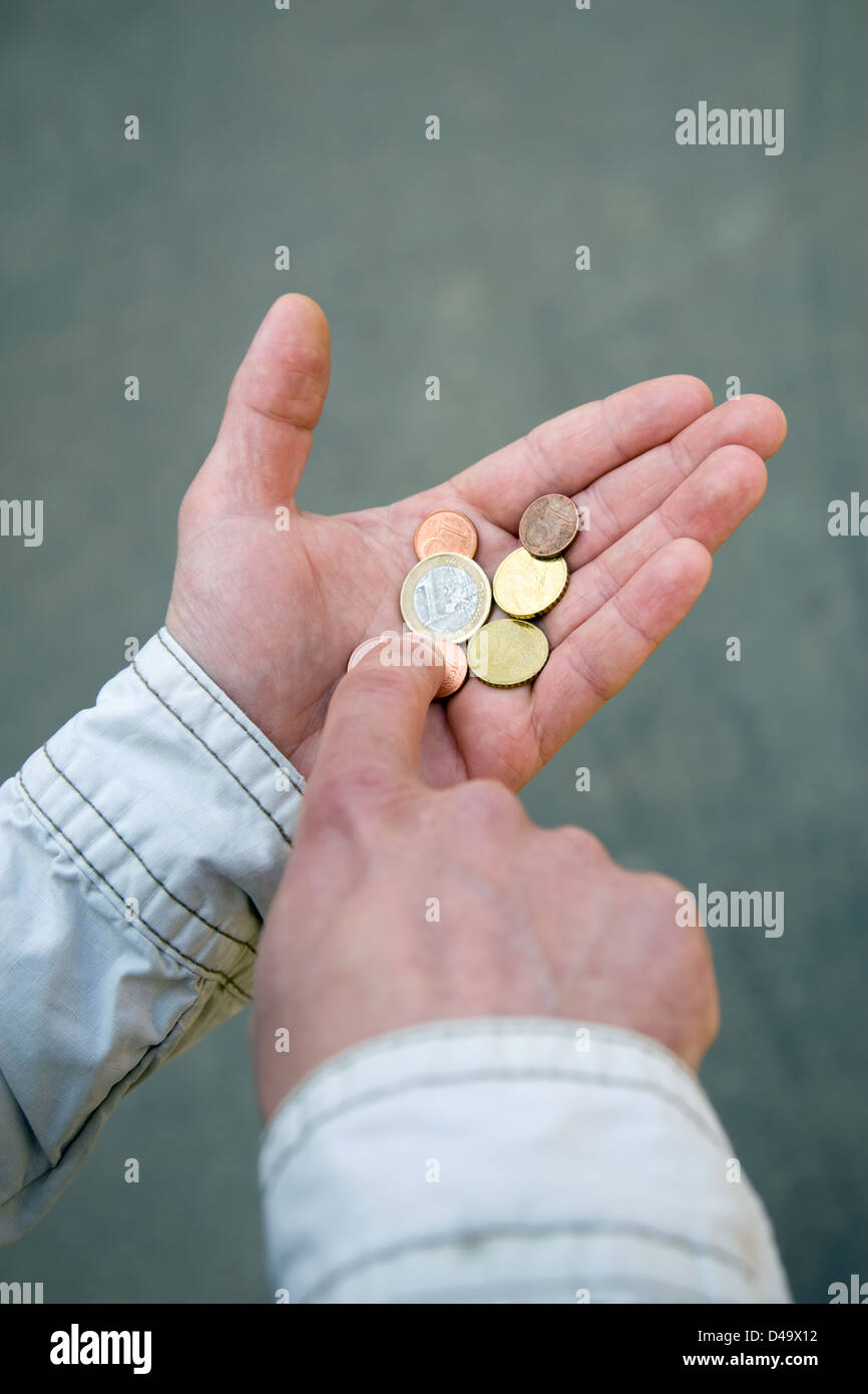 Berlin, Germany, hand with some coins Stock Photo