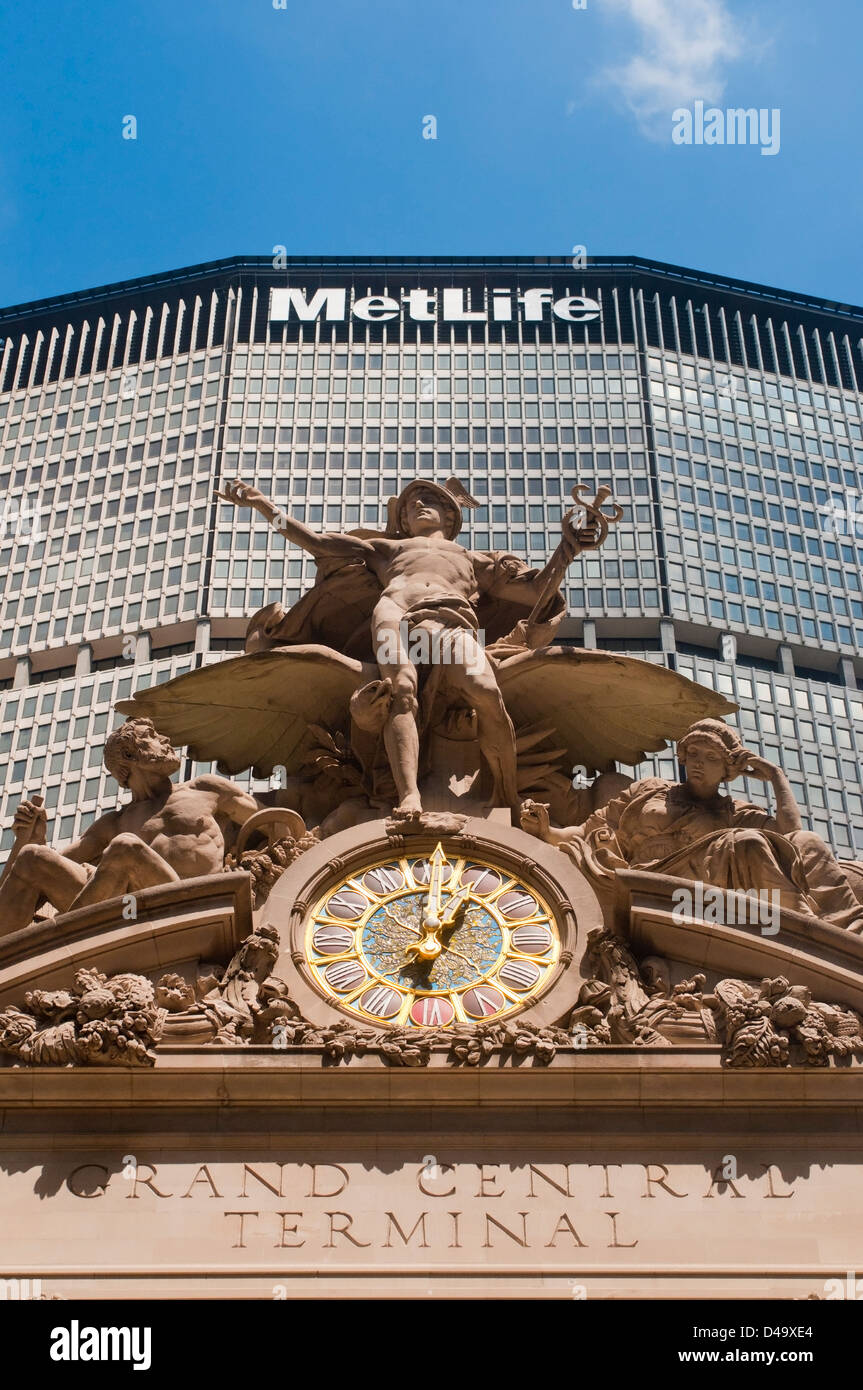The Statue of Mercury atop Grand Central Station against the Met Life Building on Park Avenue in Midtown Manhattan Stock Photo