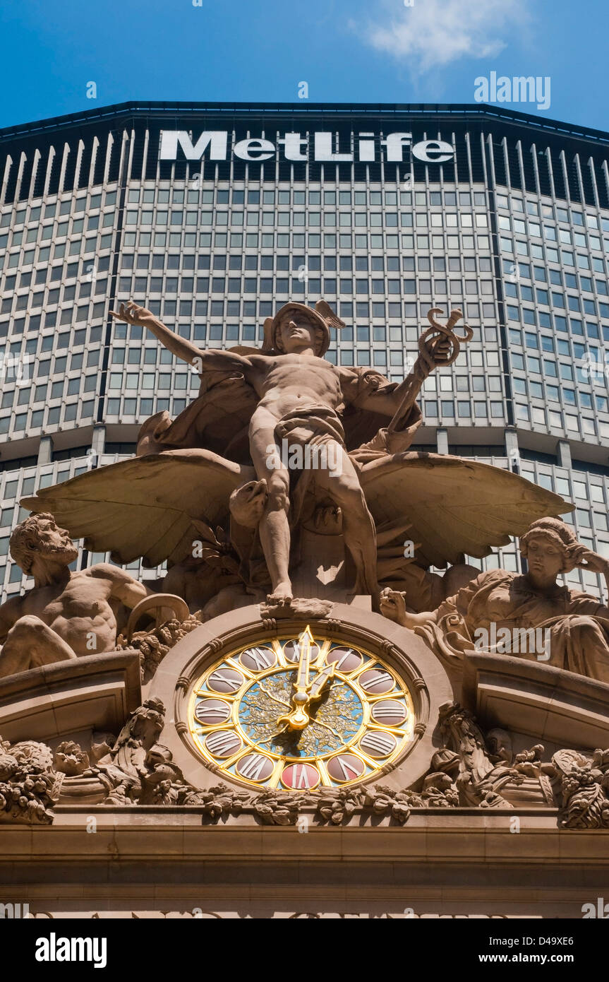 The Statue of Mercury atop Grand Central Station against the Met Life Building on Park Avenue in Midtown Manhattan Stock Photo