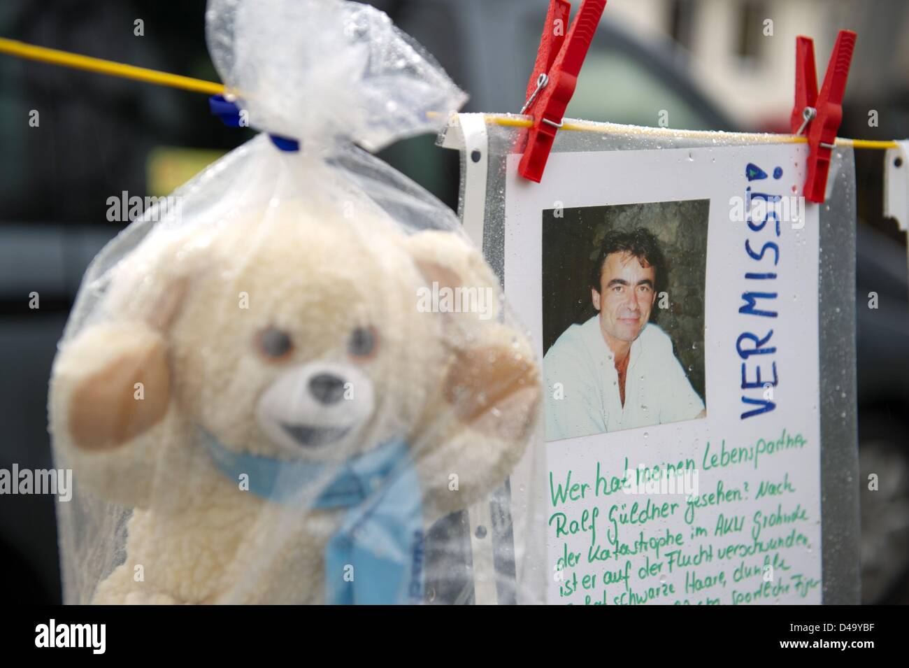 A ficticious missing person sign and a cuddly toy wrapped in plastic foil ang attached to a rope during an anti-nmuclear protest in Lamspringe, Germany, 9 March 2013. The environmental group Robin Wood organised the anti-nuclear protest to draw attention to the 2nd anniversary of the Fukushima disaster. Photo: Sebastian Kahnert Stock Photo