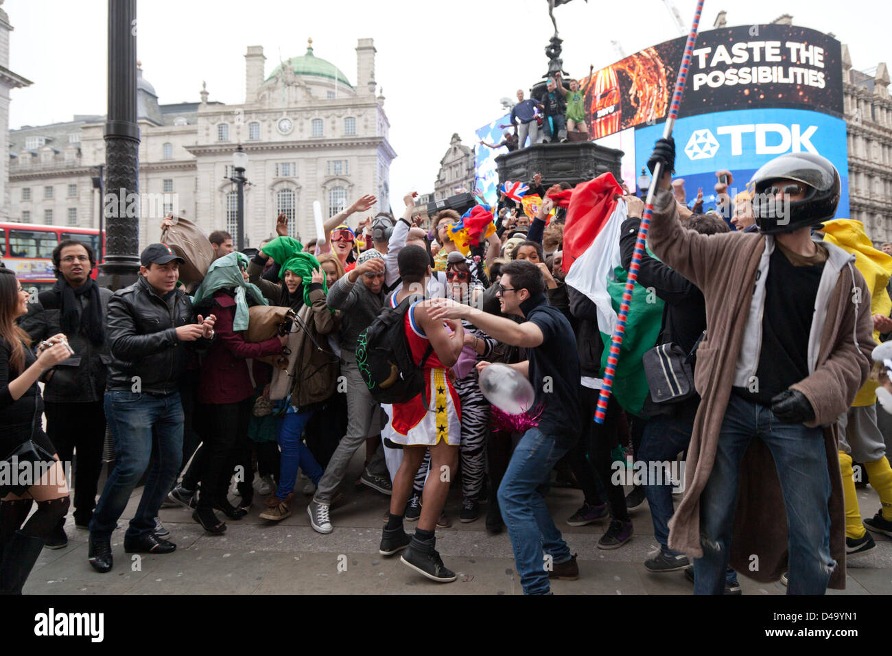 London, UK. 9th March, 2013. A large group of people gathered in Piccadilly to try and create London’s biggest Harlem Shake. The latest Internet craze involves a video of about 30 seconds with people dressed in various outfits dancing to a specific song. Stock Photo