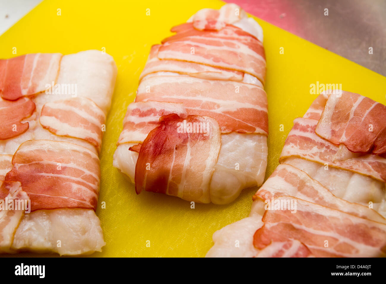 Catfish fillet wrapped in bacon Stock Photo Alamy