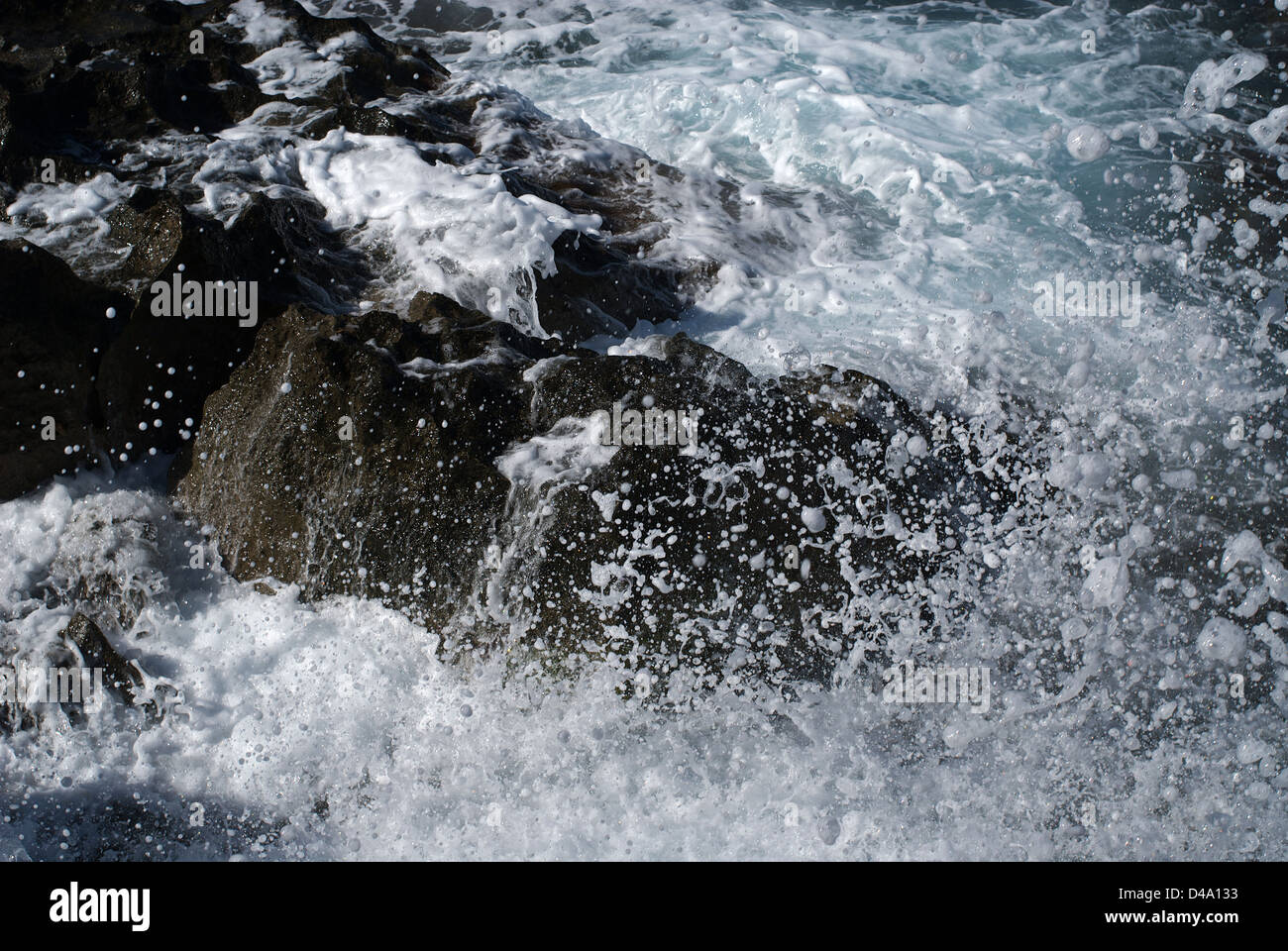 Sardinia, Italy, waves breaking on the rocks on the beach of Costa Verde Stock Photo