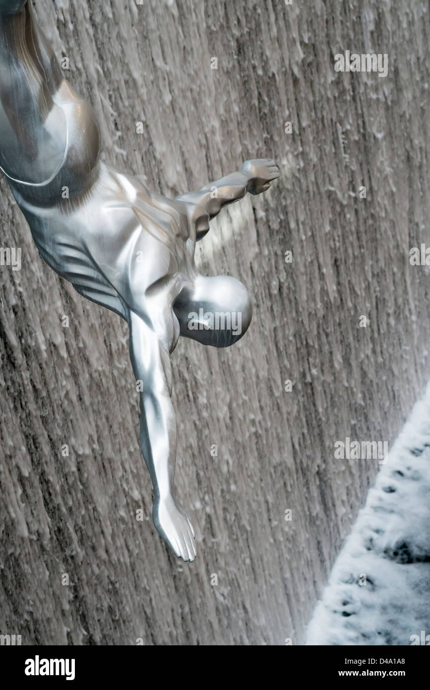 Detail of diving sculpture in waterfall at Dubai Mall shopping centre