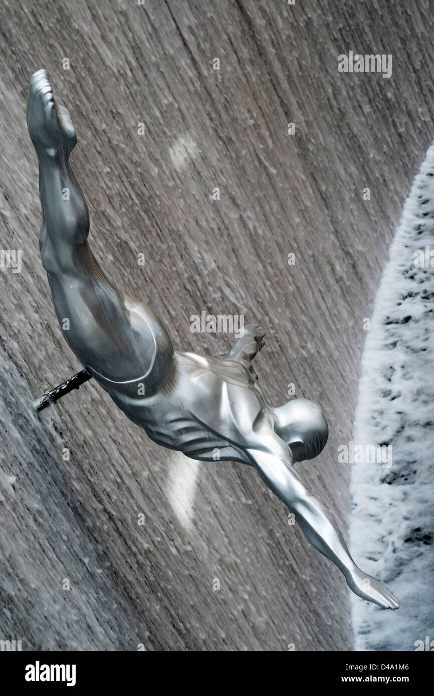 Detail of diving sculpture in waterfall at Dubai Mall shopping centre