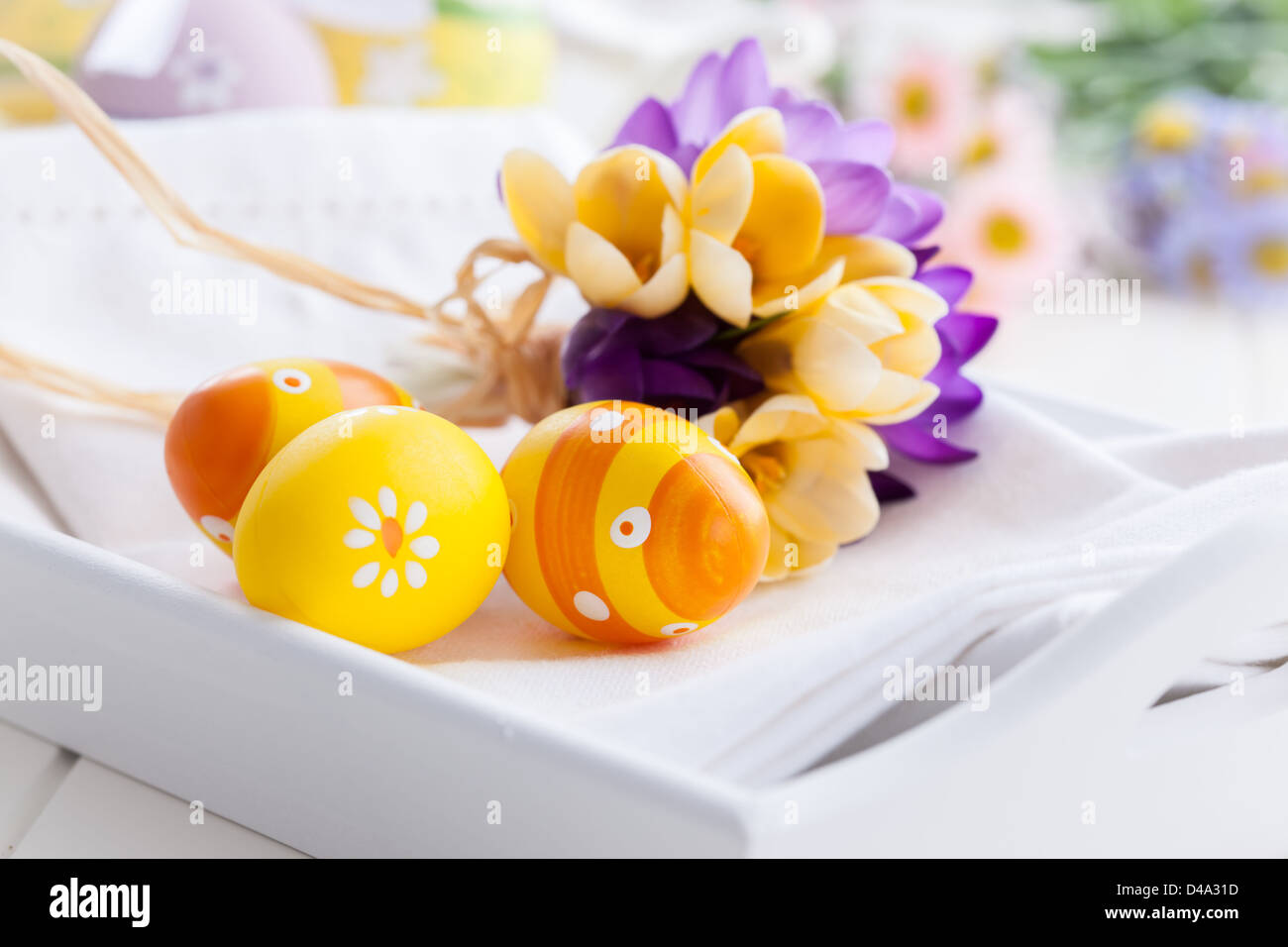 Spring flowers and Easter eggs decorating table Stock Photo - Alamy