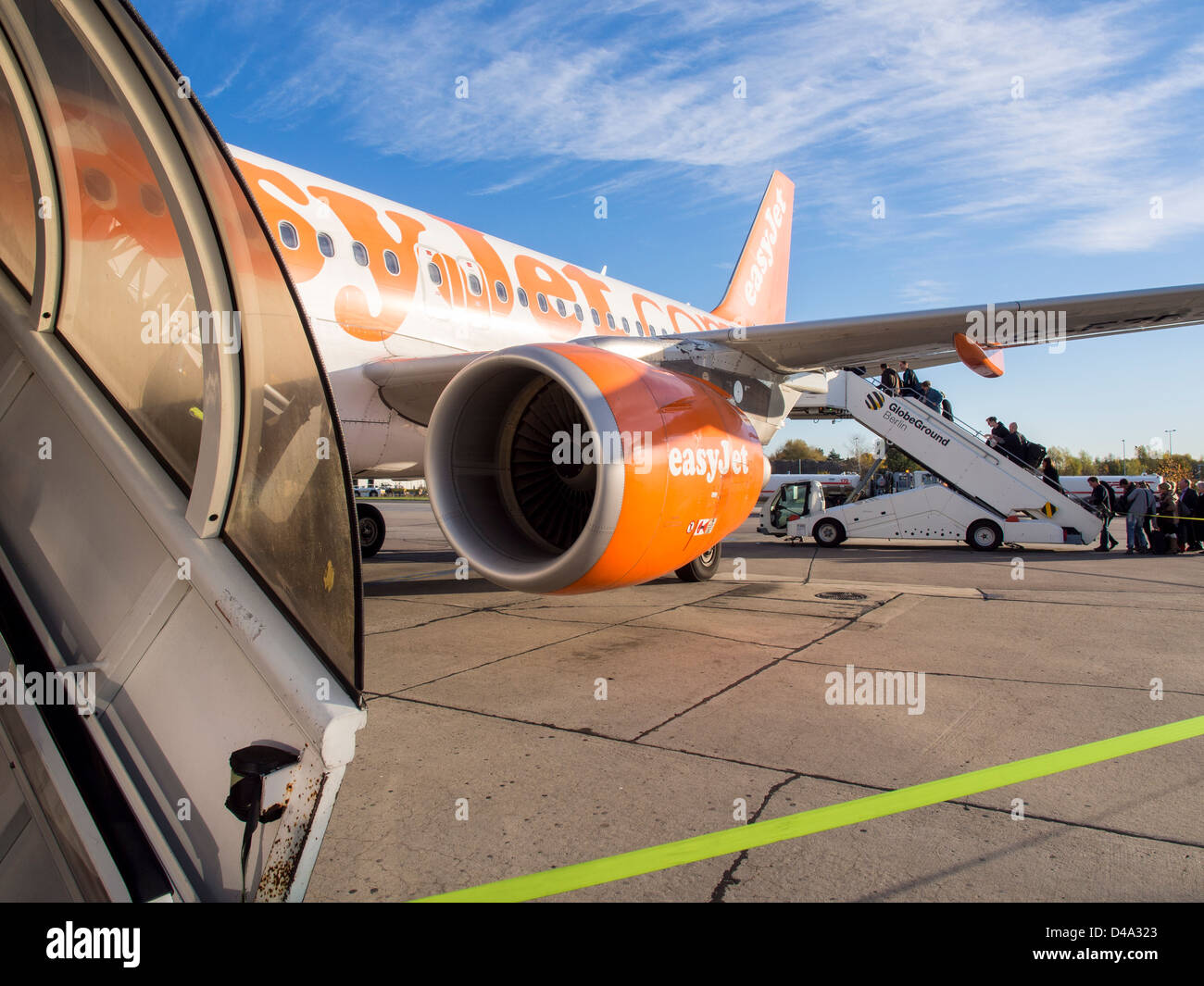Passengers boarding an easy jet plane Stock Photo - Alamy