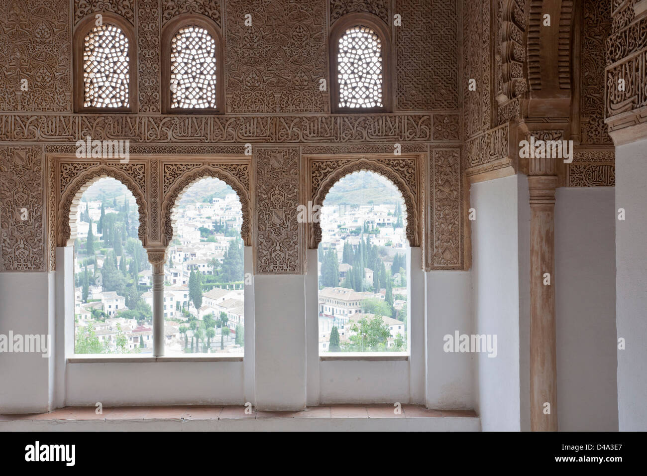 Decorated windows with a view to Albayzín district in Alhambra, Granada Stock Photo