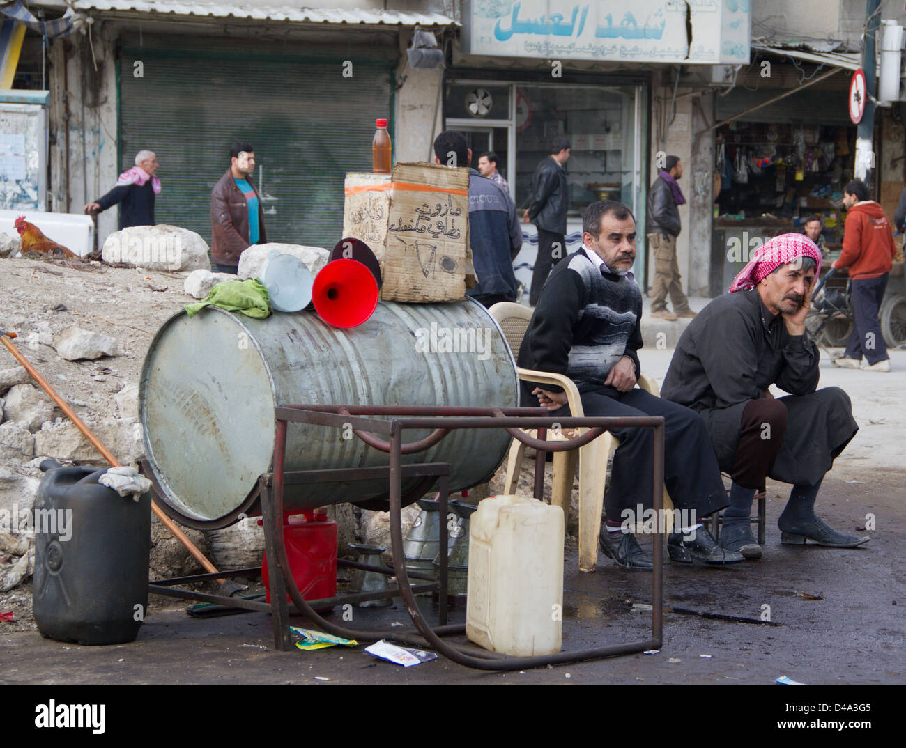 March 2, 2013 - Aleppo, Syria: Men sit at a gas station in the Marge section of Aleppo Syria on March 2, 2013. Stock Photo