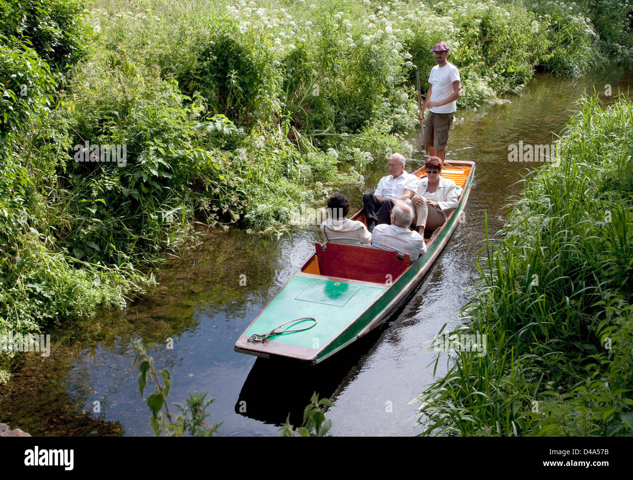 Punting along a side stream of the River Stour in Canterbury Stock Photo