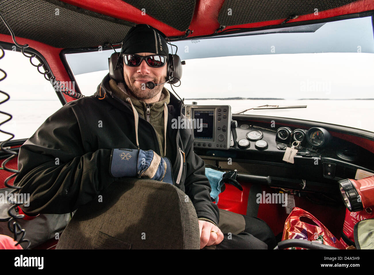 Interior of Hovercraft and pilot on frozen Baltic sea Swedish Lapland Sweden Scandinavia Stock Photo