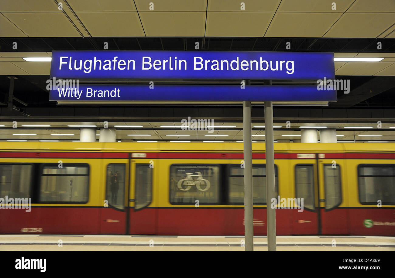 A city train arrives at the railway station of the Berlin Brandenburg