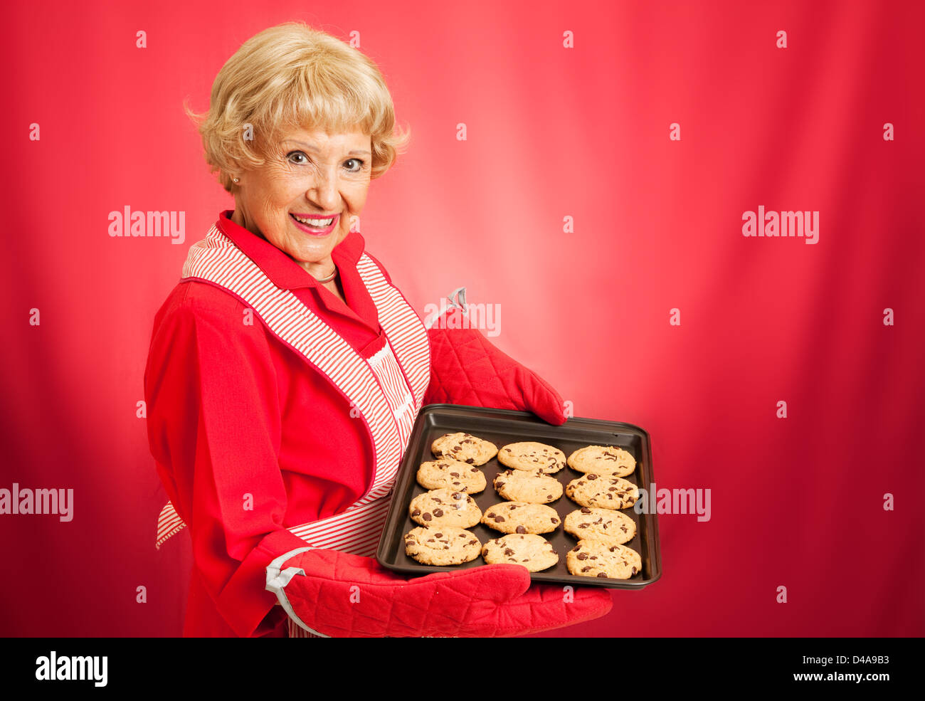 Sweet retro grandmother bakes chocolate chip cookies Stock Photo Alamy