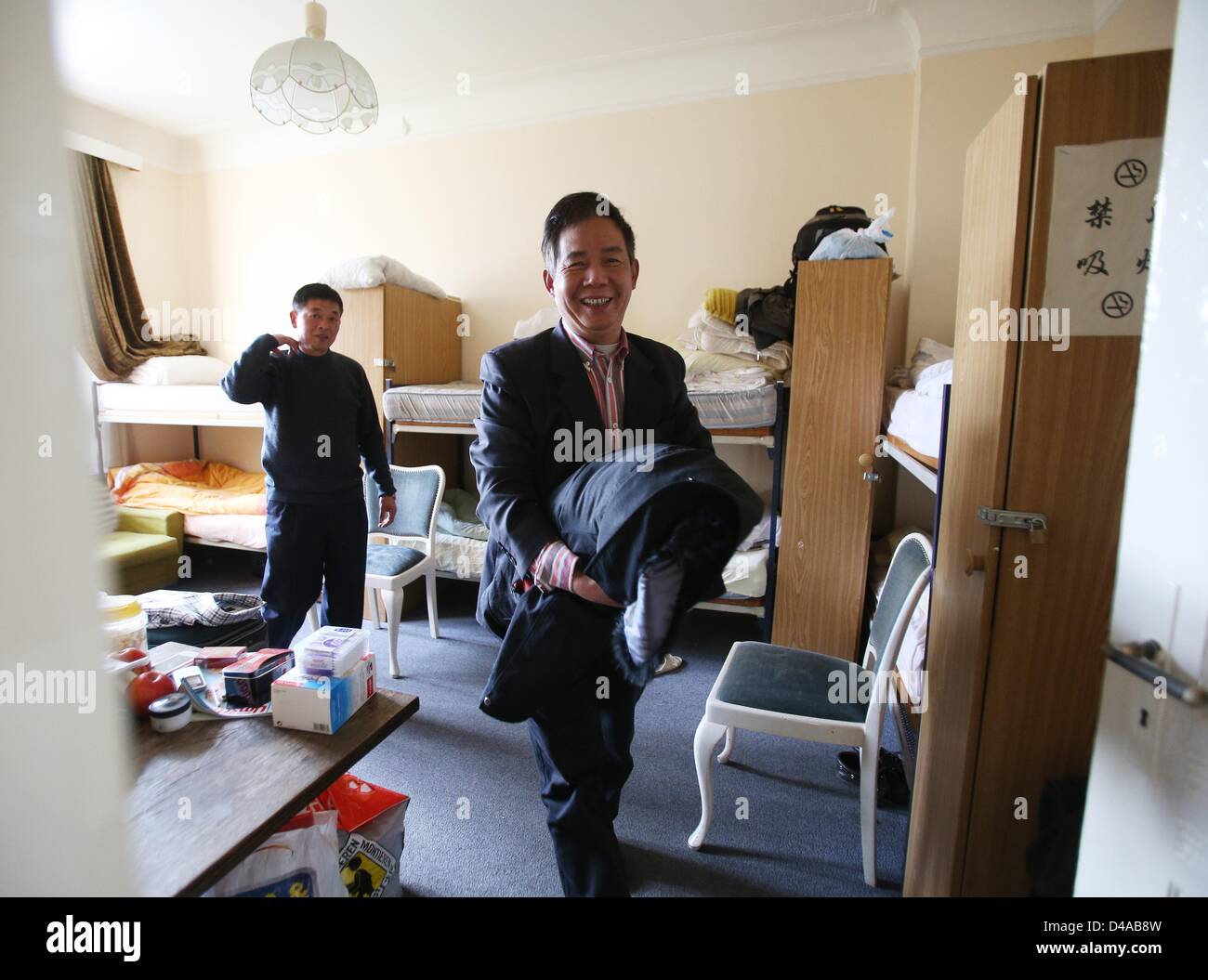 Two Chinese sailor are pictured in one of the guest rooms of the Home for Chinese Sailors in Hamburg, Germany, 27 February 2013. The first and only home for Chinese sailors was founded in 1962 by the family Chen. Photo: Christian Charisius Stock Photo