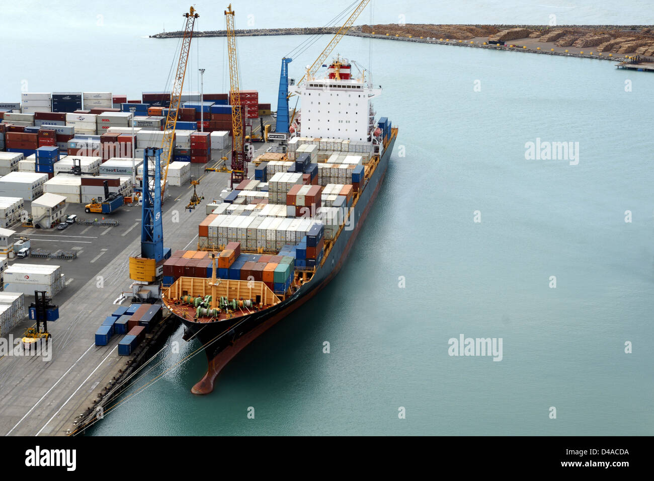 The container ship Kota Lukis being loaded at the port of Napier in New Zealand Stock Photo