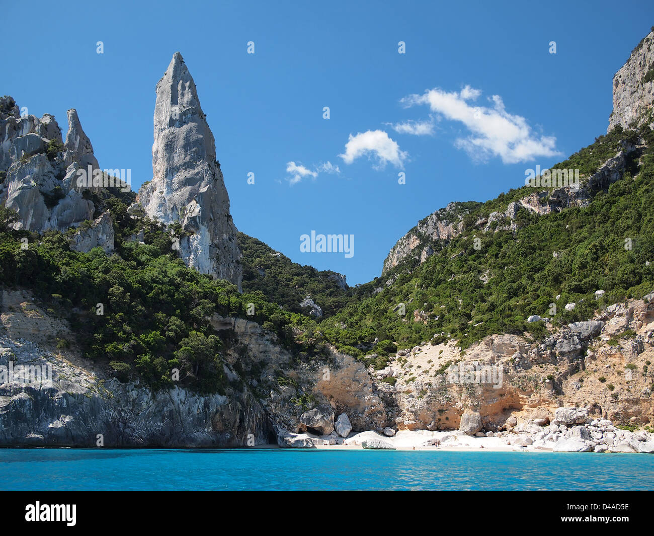 Aguglia pinnacle famous for rock climbing on the deserted Cala Goloritze beach, only accessible by boat, in the Gulf of Orosei. Stock Photo