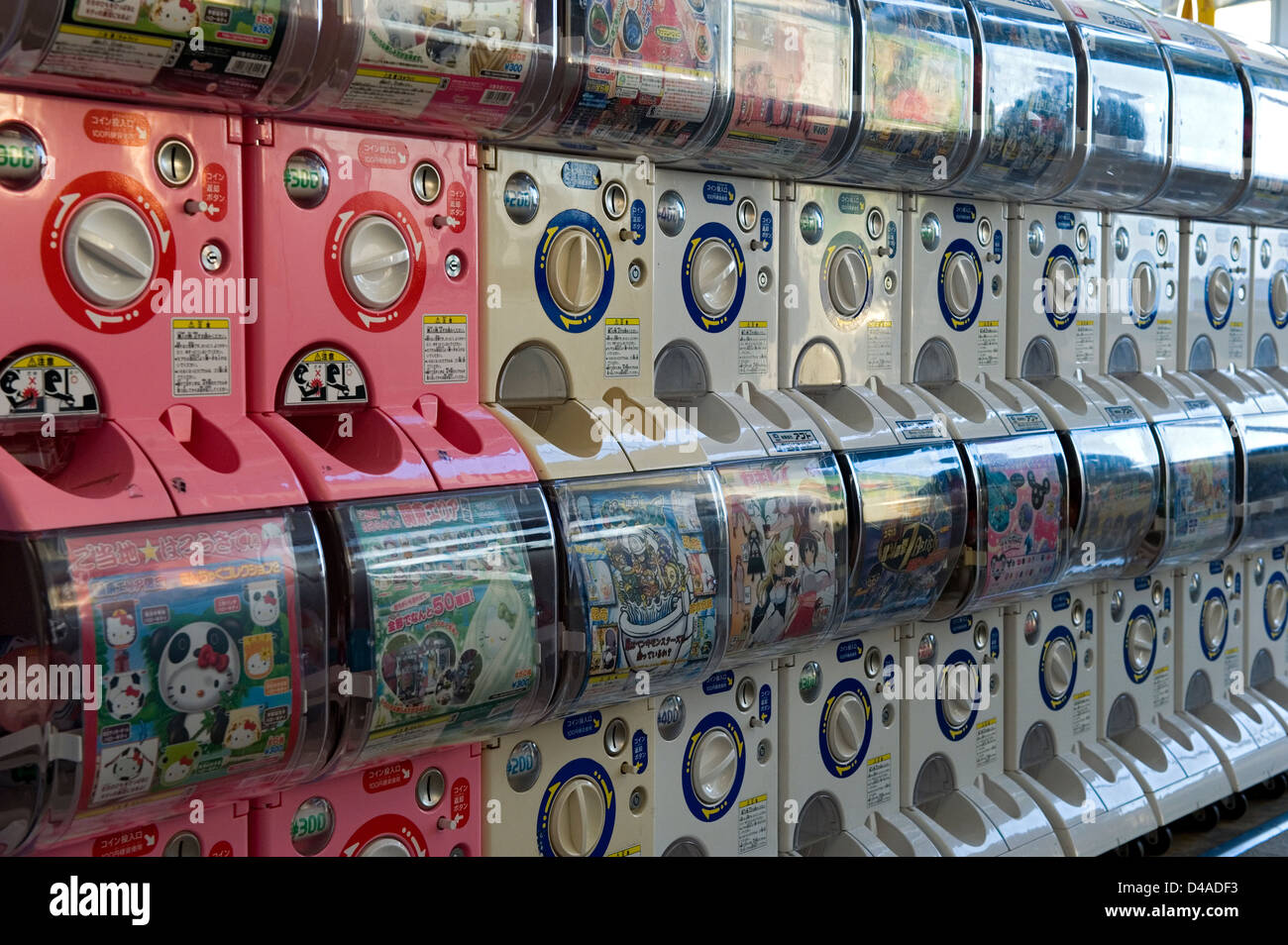 A row of 'gachapon,' or toy-in-a-capsule vending machines, popular with kids and teens in Japan. Stock Photo