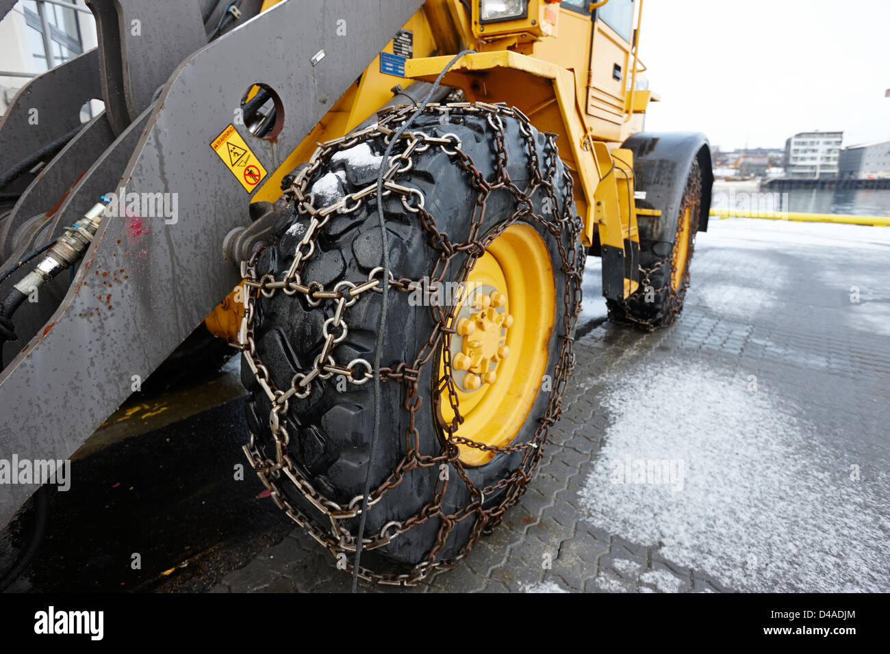 heavy duty snow chains on plant configured for snow clearance Tromso Stock  Photo - Alamy