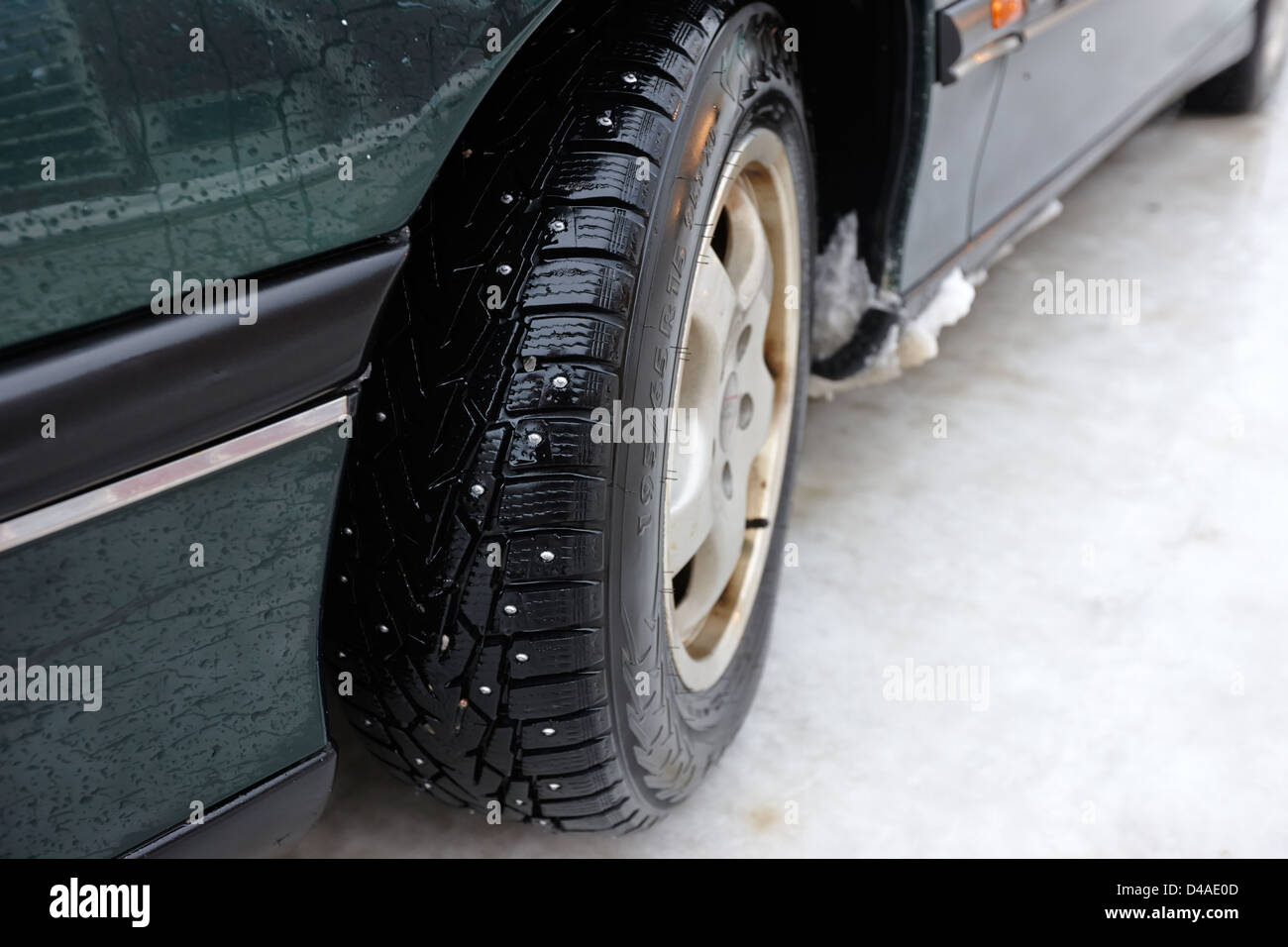 car with studded winter tyres on ice norway europe Stock Photo