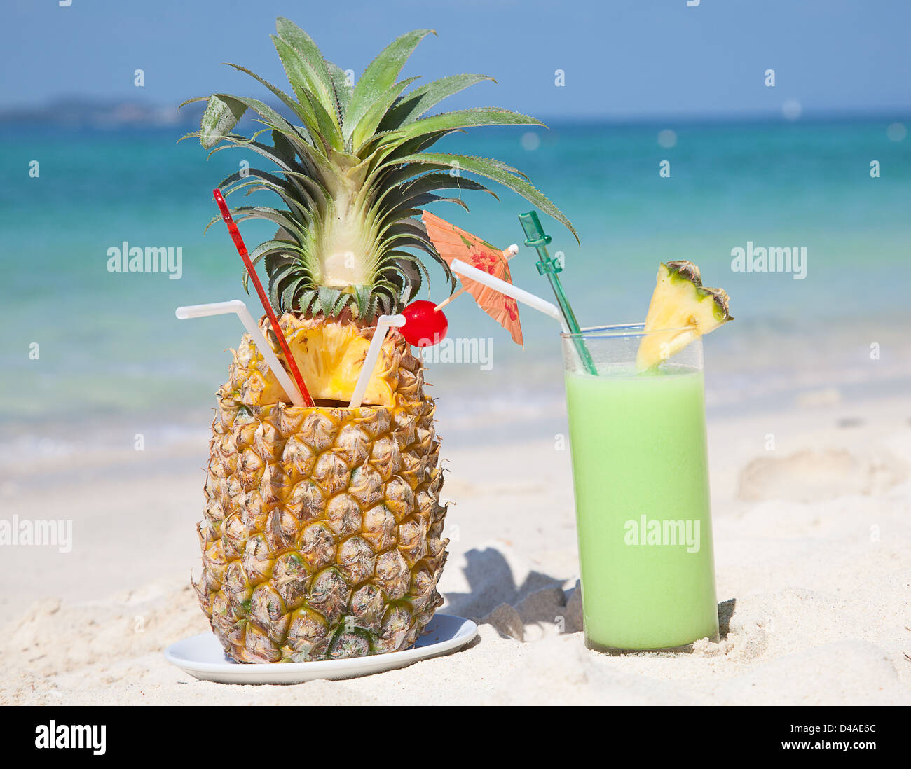 Fresh fruit cocktail on a tropical island beach Stock Photo - Alamy