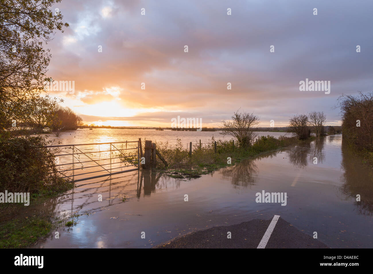Dawn over the flooded Glastonbury to Street road after the River Brue burst its banks Stock Photo