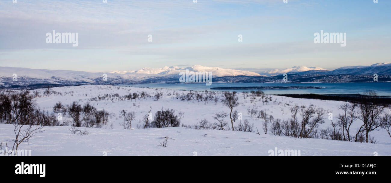 The view from Kvaløya, or Whale Island, across to Tromsø, in Norway taken in February. Stock Photo