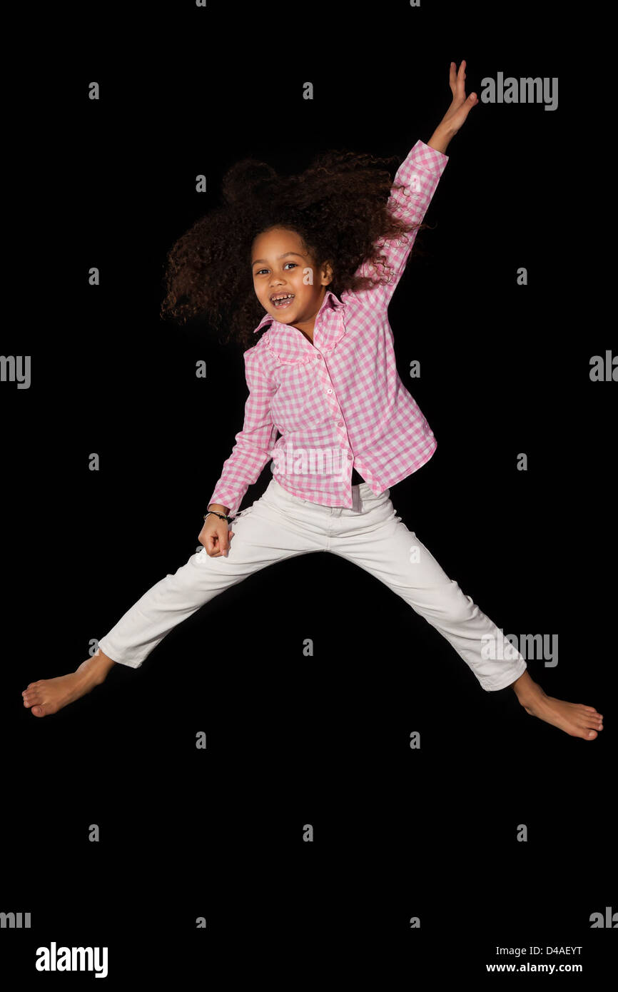 Little Africanamerican Girl Jumping Over Studio Background Stock Photo -  Download Image Now - iStock