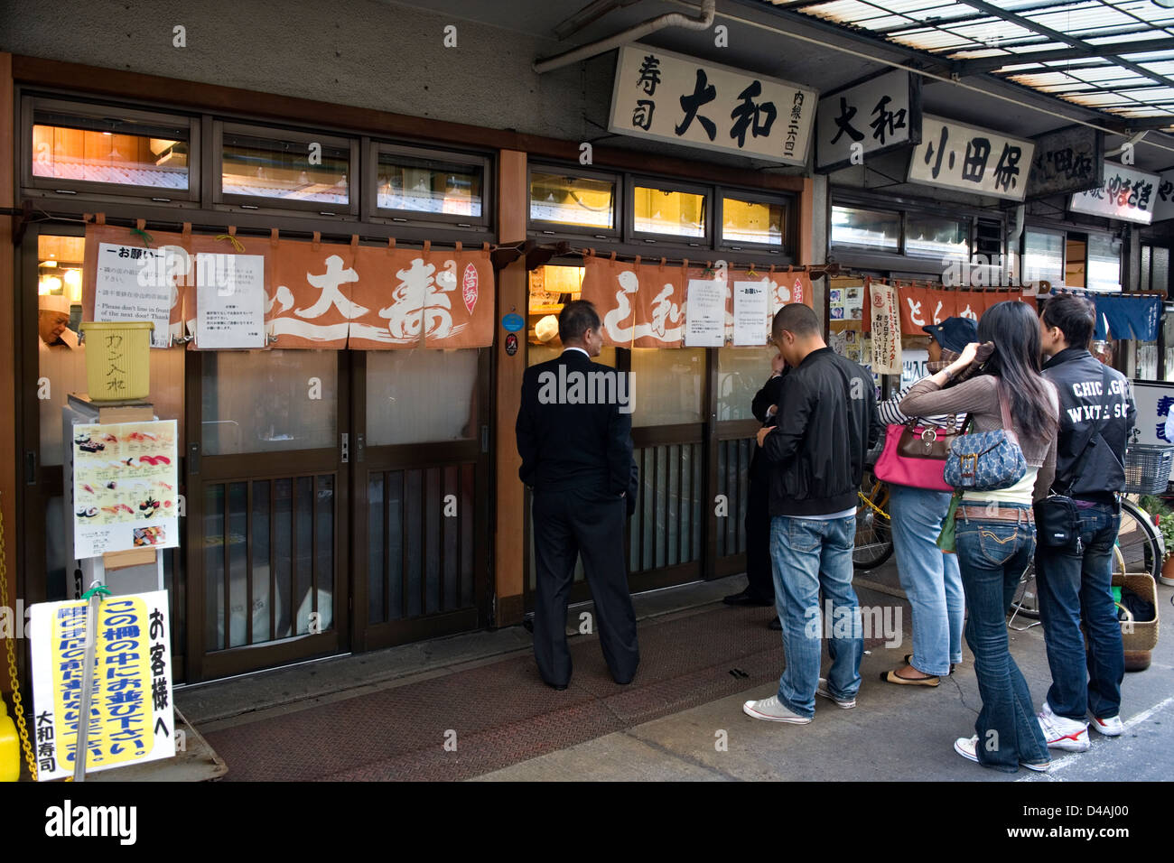 Lines form early in the morning for breakfast at sushi restaurants near