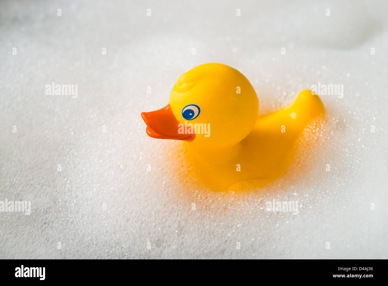 Yellow rubber duck in a bath surrounded by bubbles Stock Photo - Alamy