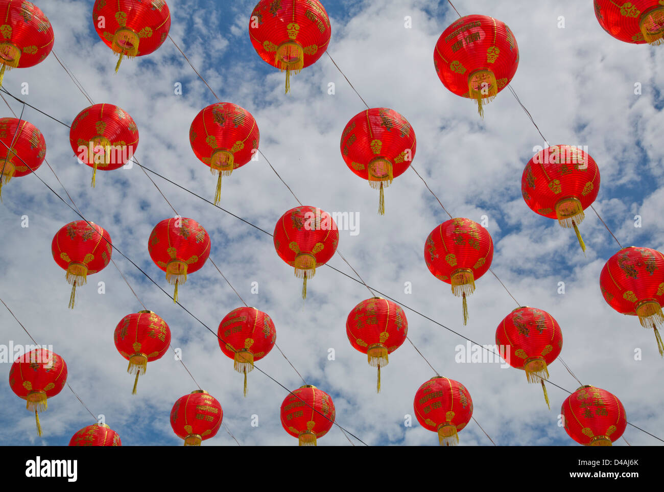 Chinese red lanterns against cloudy blue sky Stock Photo - Alamy