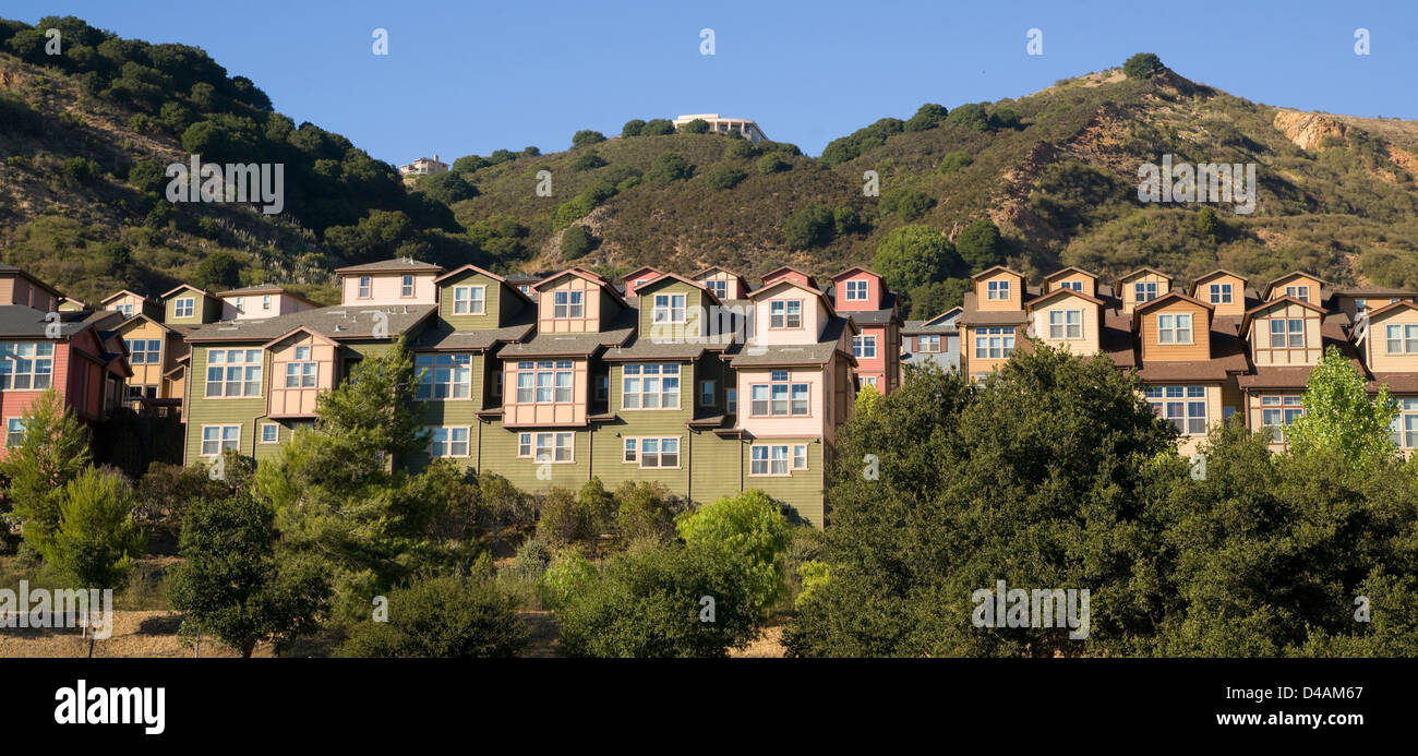 Urban Sprawl Makes it to the Country Homes Spring up For Domestic Living on Hillside Stock Photo