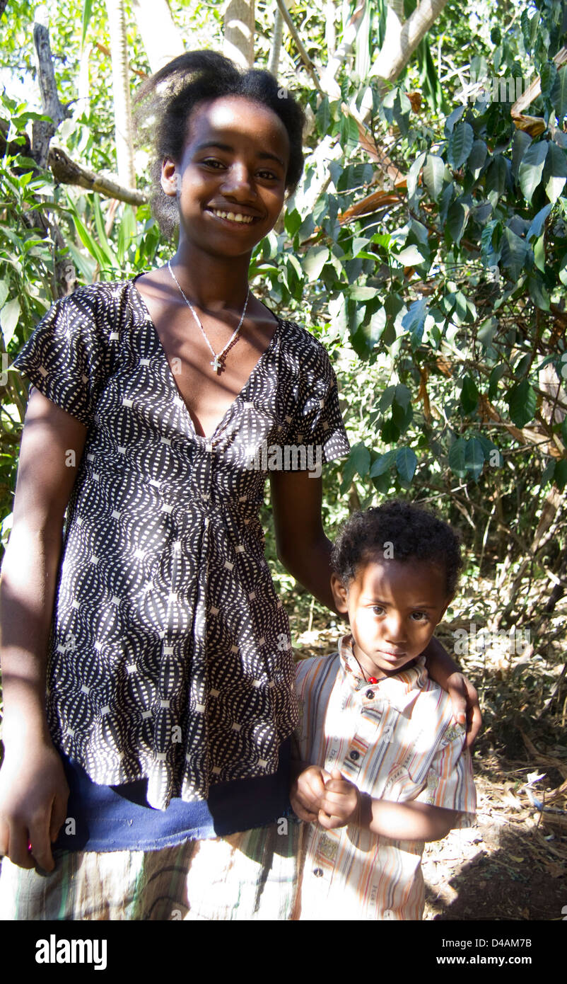 Girl and toddler in shade, Bahar Dar, Ethiopia, Africa Stock Photo
