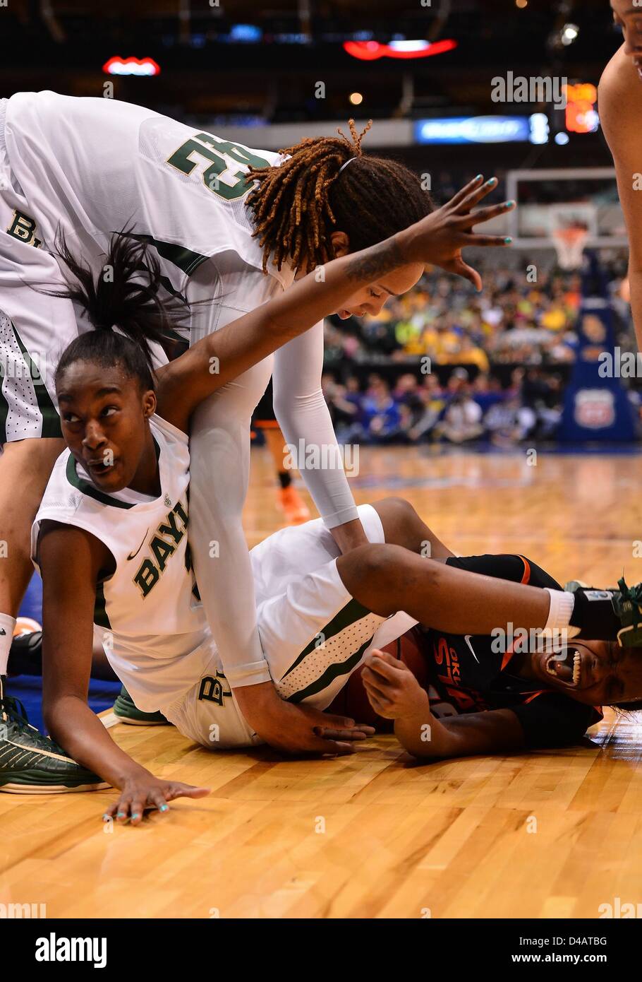 March 10, 2013 - Dallas, TX, United States of America - March 10, 2013..Baylor guard Jordan Madden #3 lands on Oklahoma State forward Toni Young #15 while attempting for ball possesion during BIG 12 Women's Basketball Championship semifinal game at American Airline Center in Dallas, TX. Baylor defeat Oklahoma State 77-69 to advance to the final. Stock Photo